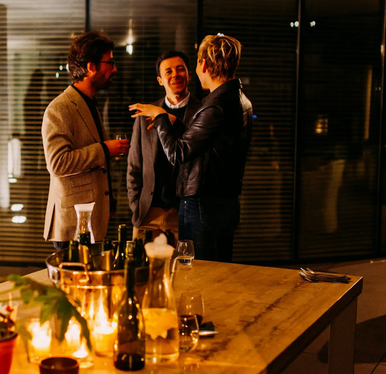 five person standing while talking each other